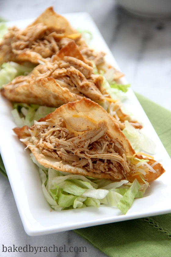 Spicy Slow Cooker Chicken Wonton Tacos Recipe from bakedbyrachel.com