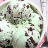 Creamy homemade mint ice cream with chocolate cookie chunks throughout. Recipe at bakedbyrachel.com