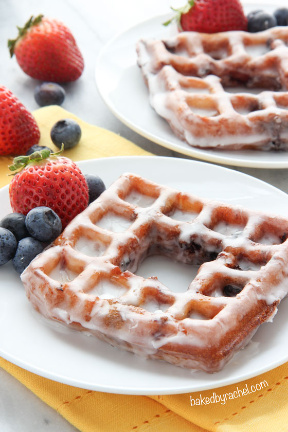 Deep fried berry waffles coated in a sweet lemon glaze. Recipe from @bakedbyrachel