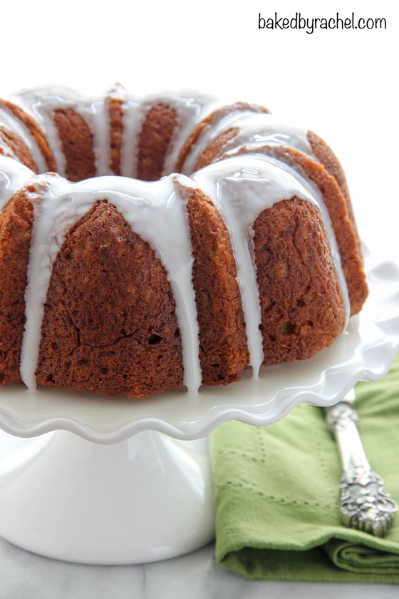 Moist banana bundt cake with sweetened coconut throughout and a tart lime glaze. Recipe from @bakedbyrachel