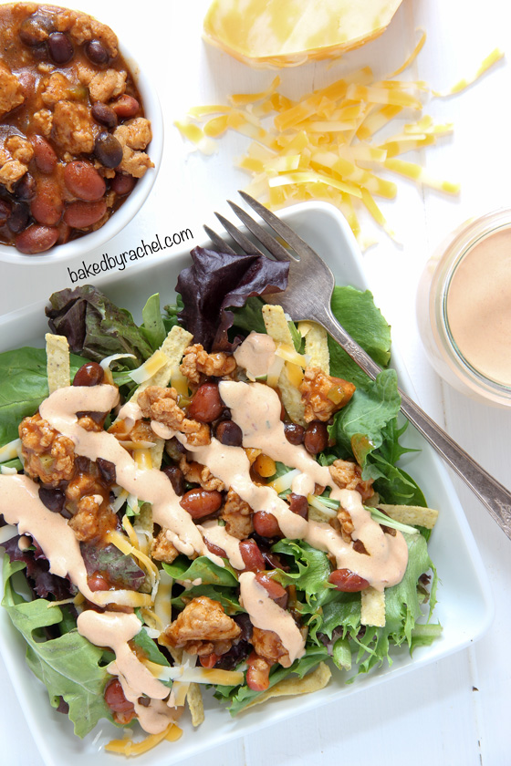 Southwestern chili taco salad with homemade chipotle ranch dressing. Recipe from @bakedbyrachel