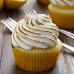 Moist lemon cupcakes with sweet lemon curd filling and meringue frosting recipe from @bakedbyrachel
