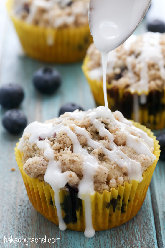 Moist blueberry streusel muffins with a sweet vanilla glaze. Recipe from @bakedbyrachel