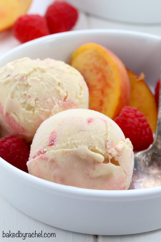 Creamy peach ice cream with raspberry swirls. Recipe from @bakedbyrachel