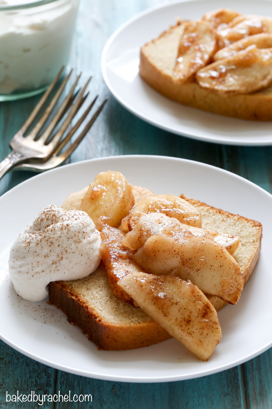 Cinnamon yogurt pound cake served with cinnamon apples and brown sugar whipped cream. Recipe from @bakedbyrachel
