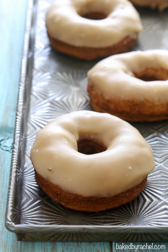 Homemade fried pumpkin yeast donuts with a sweet brown sugar maple glaze recipe from @bakedbyrachel
