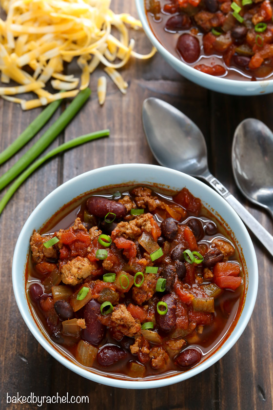 Sweet and spicy hearty slow cooker turkey and two bean chili recipe from @bakedbyrachel