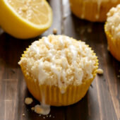 Moist and fluffy homemade lemon crumb muffins with a sweet lemon glaze. Recipe from @bakedbyrachel