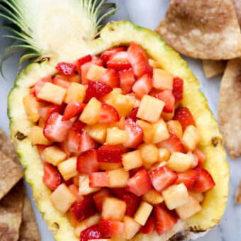 Strawberry pineapple salsa with cinnamon tortilla chips. Recipe from @bakedbyrachel A family friendly snack or appetizer!
