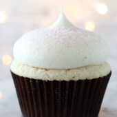 Moist homemade white chocolate cupcakes with white chocolate peppermint cream cheese frosting recipe from @bakedbyrachel