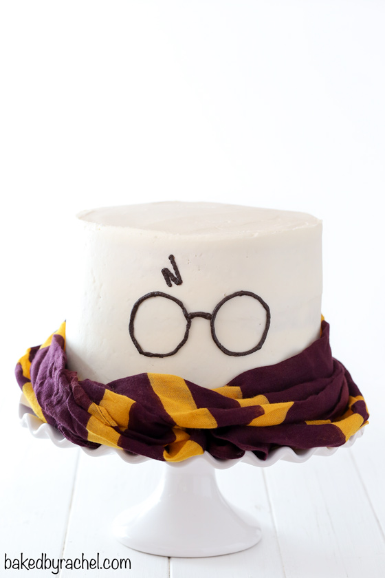 Harry Potter themed layer cake with fluffy vanilla buttercream frosting recipe from @bakedbyrachel. A fun birthday or celebration cake for any Harry Potter fan!