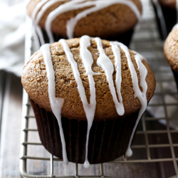 Moist gingerbread muffins with a sweet vanilla glaze. Recipe from @bakedbyrachel