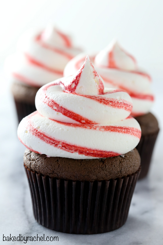 Chocolate candy cane cupcakes with striped peppermint buttercream frosting recipe from @bakedbyrachel