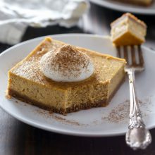 Creamy homemade pumpkin pie cheesecake bar recipe from @bakedbyrachel