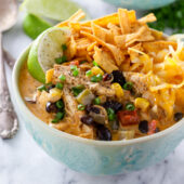 Slow cooker cheesy chicken enchilada soup recipe from @bakedbyrachel