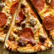 Easy thin crust three cheese spicy sausage and pepperoni pizza recipe from @bakedbyrachel