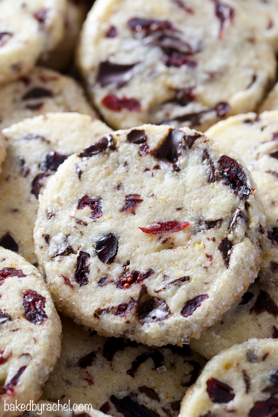 Light and flavorful slice and bake cranberry-orange chocolate chunk cookie recipe from @bakedbyrachel A fun seasonal cookie with a festive pop of color and flavor!