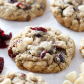 Soft and chewy cranberry white chocolate oatmeal cookie recipe from @bakedbyrachel A perfect treat for the holidays or any time of the year!