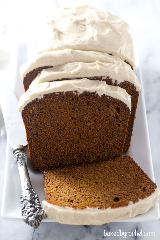 Moist homemade gingerbread loaf cake with cinnamon brown sugar cream cheese frosting recipe from @bakedbyrachel. A fun twist on a classic seasonal favorite! Enjoy this fun holiday treat for breakfast, brunch or dessert!