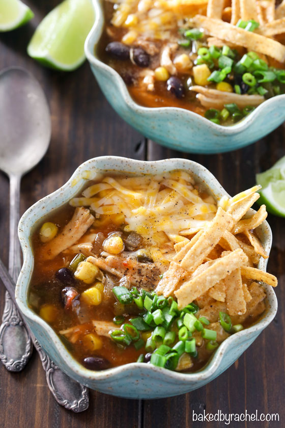 Super easy and flavorful slow cooker spicy chicken tortilla soup recipe from @bakedbyrachel. A comforting must make meal, perfect to warm up with all winter long!