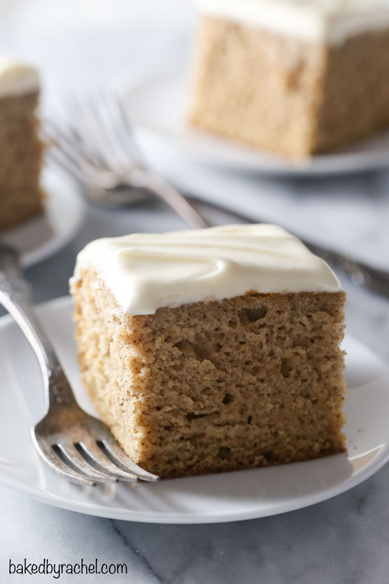 Moist and fluffy homemade cinnamon applesauce cake with silky caramel cream cheese frosting recipe from @bakedbyrachel A perfect dessert for any Fall occasion!