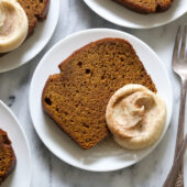 Moist homemade classic pumpkin spice loaf cake recipe from @bakedbyrachel Serve with optional brown sugar cream cheese frosting for an extra special touch. Enjoy this classic Fall treat for breakfast or dessert!