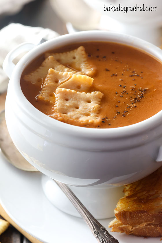 Super easy homemade creamy slow cooker tomato soup recipe from @bakedbyrachel This classic cold weather comfort food is a perfect meal to warm up with all winter long. This easy recipe is a perfect meal for any night of the week!